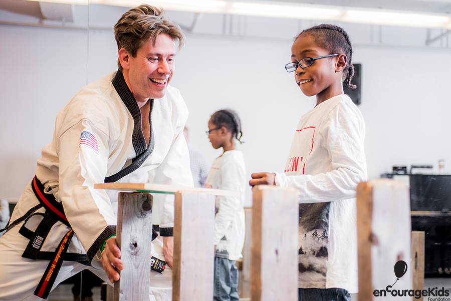 Leif teaching martial arts to young student