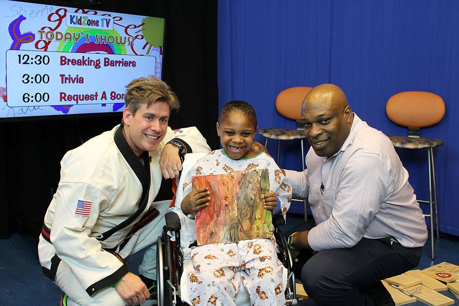 Leif visiting young patient in hospital