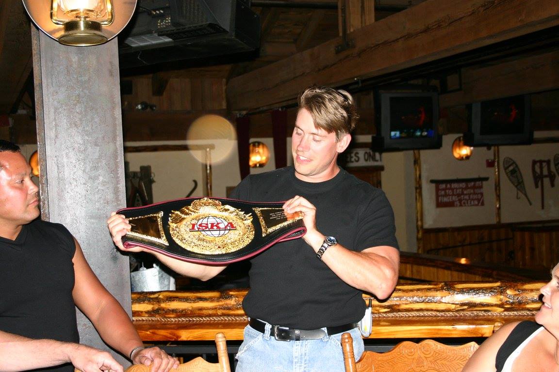Leif Becker holding championship belt