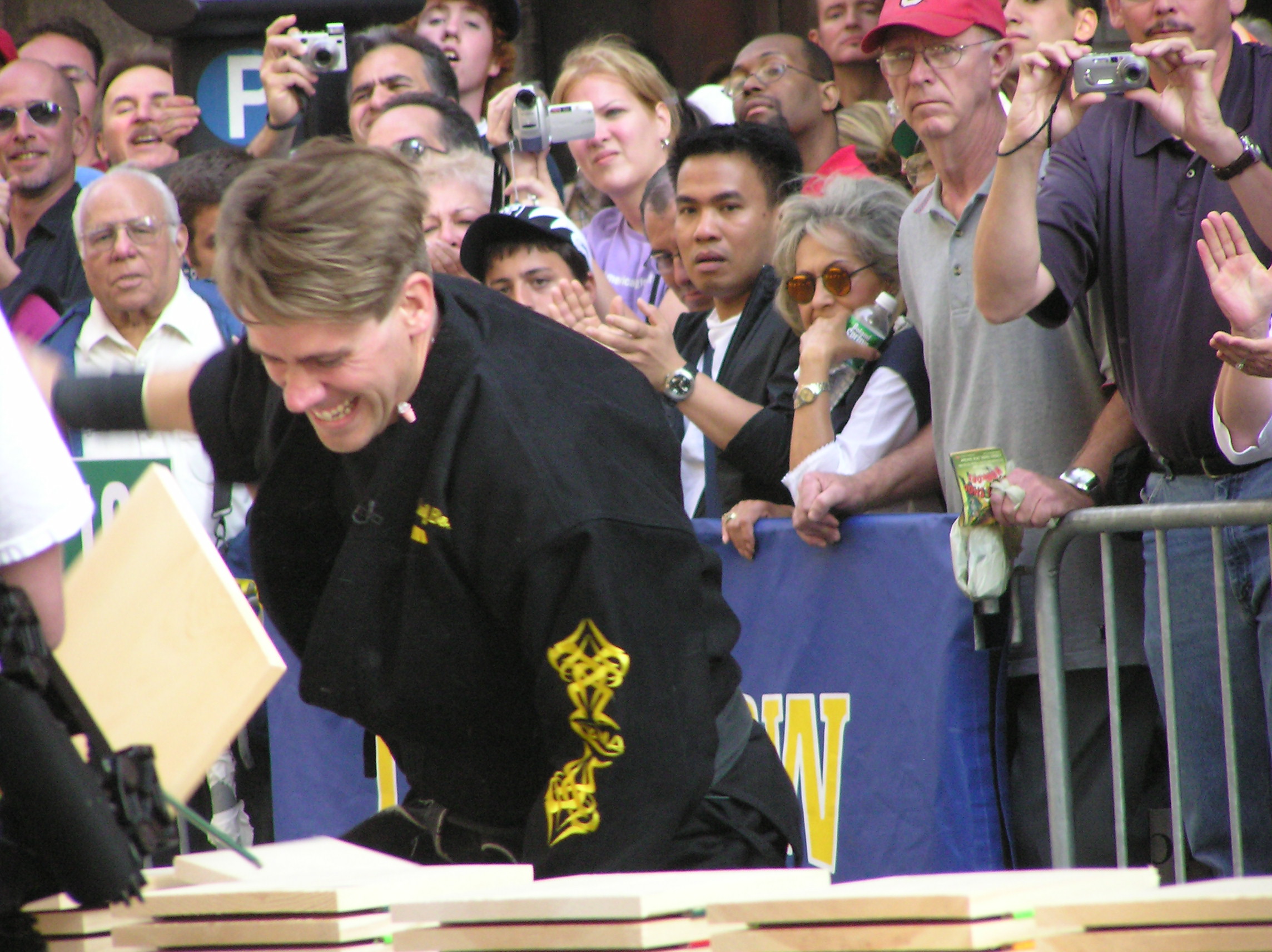 Leif breaking boards in front of excited crowd