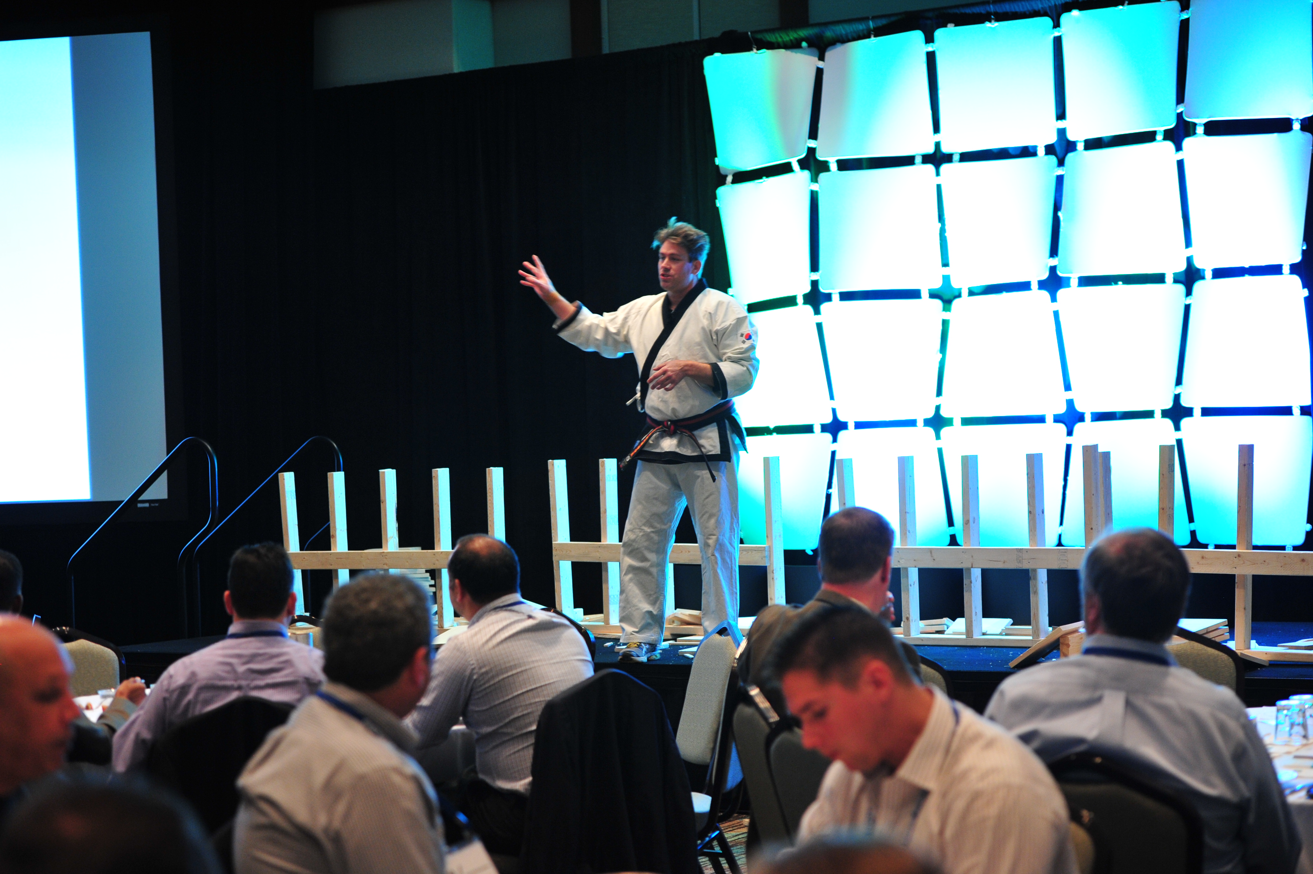 Leif speaking to corporate audience with board breaking setup